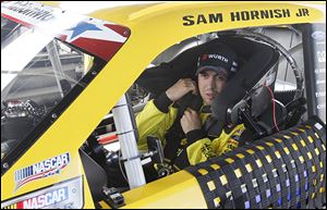 Sam Hornish, Jr., tests his Alliance Truck Parts/​WURTH Ford Mustang on the half-mile Toledo Speedway oval in preparation for short-track races on the Nationwide series.
