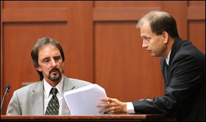Assistant State Attorney Richard Mantei, right, challenges forensics animation expert Daniel Shumaker during cross examination of his testimony during George Zimmerman's trial in Seminole Circuit Court in Sanford, Fla.
