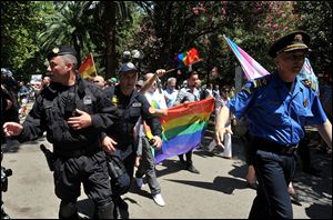 Montenegro gay activists march down a street during the first ever pride event in the Montenegrin seaside resort of Budva today.