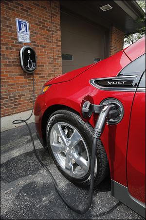 A Chevrolet Volt electric automobile is charged in Perrysburg.