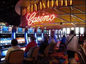 Gamblers play the slot machines in the Hollywood Casino Columbus.