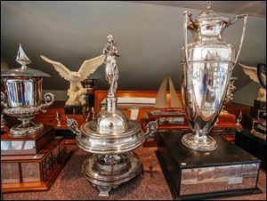 The Emery D. Potter trophy, center, is pictured in the trophy case at the Toledo Yacht Club. 