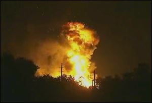 Flames rise from an explosion at the Blue Rhino propane plant in Tavares City, Fla., late Monday.