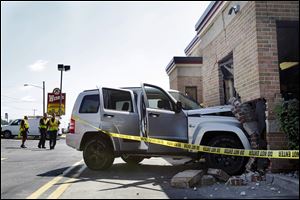 The inside of the Wendy’s on West Laskey Road was damaged when Joseph Lisowski lost control of his Jeep and crashed through a brick wall. Two employees and Lisowski were injured.