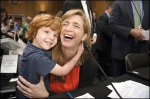 U.S. Ambassador to the U.N. nominee Samantha Power hugs her her four year-old son Declan Power Sunstein at the conclusion of her confirmation hearing last week in Washington.