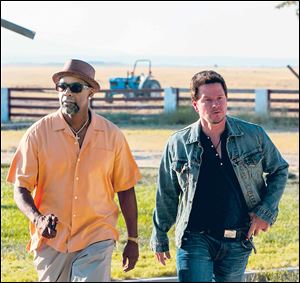 Denzel Washington and Mark Wahlberg in a scene from ‘2 Guns.’