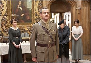 From left, Elizabeth McGovern, Hugh Bonneville, Maggie Smith, and Michelle Dockery are shown in a scene from the second season of 'Downton Abbey.'  The series has catapulted viewership of PBS.