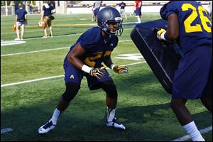 Toledo defensive back Jordan Martin runs drills during the Rockets’ practice on Thursday. It was the freshman’s first practice.