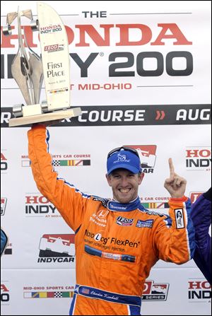 Charlie Kimball celebrates his first IndyCar win at the Honda Indy 200 at Mid-Ohio Sports Car Course in Lexington, Ohio.