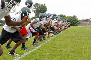 About 50 players for Start warm up with drills during the first day of high school football practice. The Spartans are coming off a one-point loss to Bowsher in the City League championship.