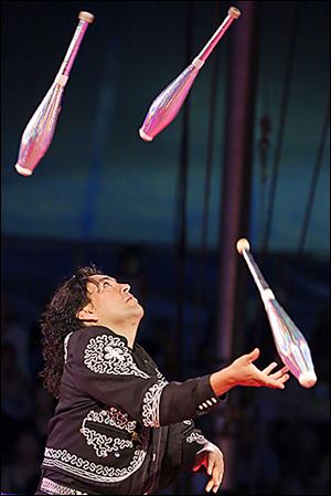 Raul Olivares juggles during a performance. The traditional circus has been a hit on Kelleys Island.