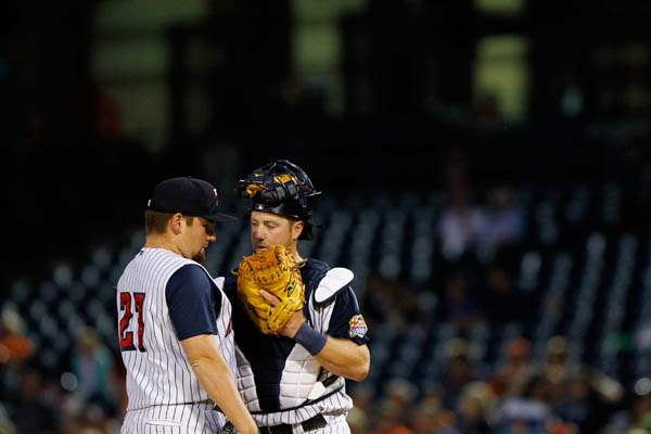 Toledo-s-Bryan-Holaday-consults-with-Kenny-Faulk-after-a-pitching-change