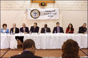 Toledo mayoral candidates Opal Covey, Alan Cox, D. Michael Collins, Michael Konwinski, Mayor Mike Bell, Joe McNamara, Anita Lopez, and Donald Gozdowski come together to meet voters for the first candidates forum, at Indiana Avenue Missionary Baptist Church.