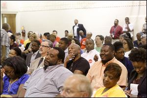 Residents listen to to the candidates. Questions from the moderators to the candidates ranged from domestic violence issues to the city budget to crime reduction and racial profiling.