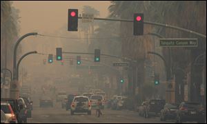 Smoke from the Silver Fire in Banning, Calif., blankets downtown Palm Springs, Calif.