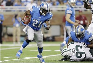 Lions running back Reggie Bush escapes to the outside during the first quarter of a preseason game against the Jets. The game was Bush's debut for Detroit, which signed him in the offseason.