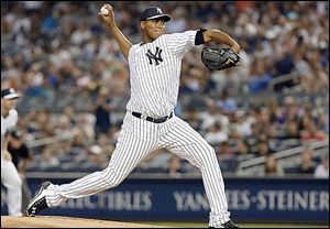 Yankees starter Ivan Nova delivers a pitch during the first inning on Friday night. Nova gave up one run in seven innings.