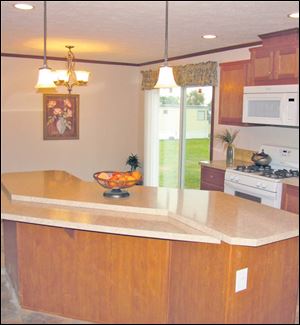 The kitchen is the heart of this home, and the large island provides an ideal work surface. 