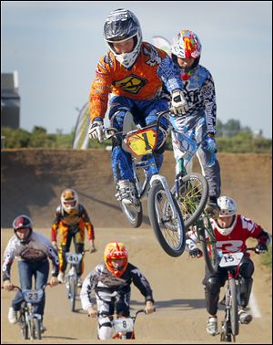 Austin McKan, Springfield, MO, leads the 16 expert class moto during the Buckeye PreRace at the USA BMX Buckeye Nationals at Toledo Speedway, Friday, August 9,  2013.