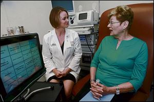 Carole Shearn, right, talks with Jocelyn Odlum, a speech pathologist at the University of Miami Miller School of Medicine.