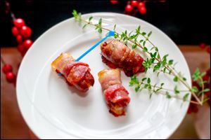 Bacon-wrapped Dates With Parmesan in a selection of hors d'oeuvres, perfect for any party, on August 8, 2013.