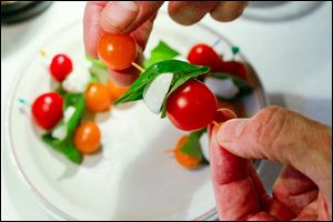 Caprese Skewers in a selection of hors d'oeuvres, perfect for any party, on August 8, 2013.