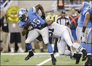 Lions running back Joique Bell is tackled by the Jets' Sheldon Richardson in a preseason game Friday.