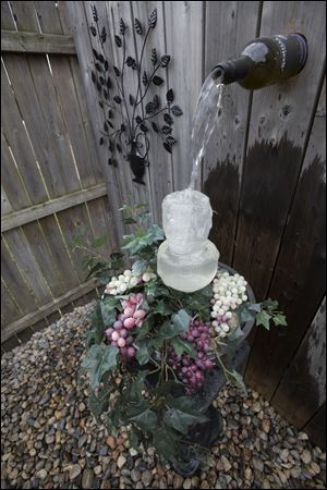 The homemade wine bottle water fountain.