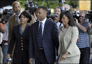 Former Illinois Rep. Jesse Jackson Jr. and his wife, Sandra, arrive at federal court in Washington, today to learn their fates when a federal judge sentences the one-time power couple.