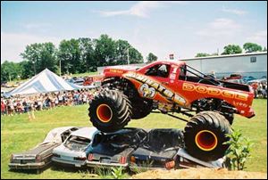 The Raminator monster truck rolls over automobile bodies with no trouble. 