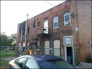 A photo submitted by the Fostoria Fire Division shows damage to a building at 116 1/2 West North Street in Fostoria, where a fire today damaged a two-story brick structure.