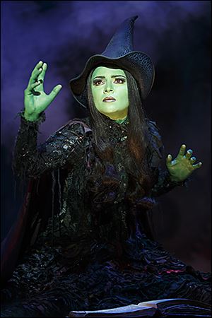 Jennifer DiNoia portrays the green-skinned Wicked Witch of the West in the production at the Stranahan Theater.