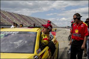 Joey Logano broke the MIS qual­i­fy­ing record with a top speed of 203.949, taking the pole for Sunday afternoon’s Pure Michigan 400.