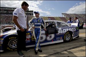 Mark Martin, rights, talks with Michael Waltrip. Martin placed fourth in Friday’s qualifying.