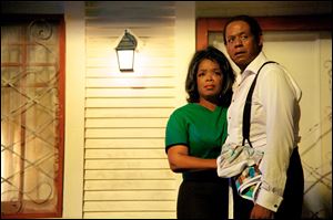 Oprah Winfrey as Gloria Gaines, left, and Forest Whitaker as Cecil Gaines in a scene from 'Lee Daniels' The Butler.'