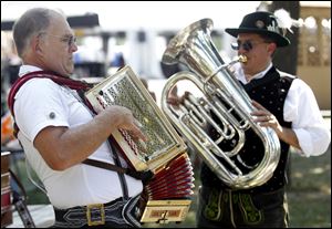 Rob Schwalbe, left, and Erwin Rauschendorfer both of Detroit, play music during the 2012 German-American Festival.