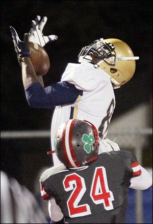 St. John's receiver Craig Mays makes a touchdown catch against Central Catholic.