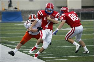 St. Francis quarterback David Nees is pushed out of bounds by Southview's Myles Magnus last season. 