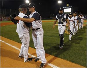 Toledo Mud Hens manager Phil Nevin congratulates winning pitcher Blaine Hardy after he pitched a 1-hitter against Gwinnett at Fifth Third Field.