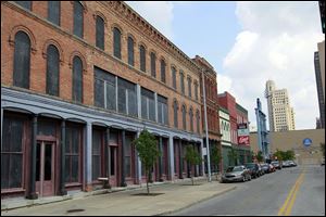 Vacant buildings on St. Clair Street would be refurbished as part of a plan by the Toledo Mud Hens.