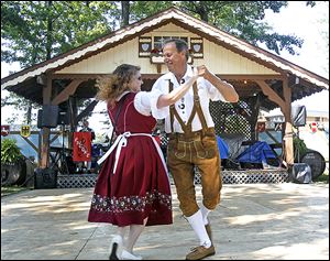 Dawn Krupinsky, left, and her husband Walter, right, from St. Clair Shores, Michigan dance a polka during the German-American Festival in 2011.