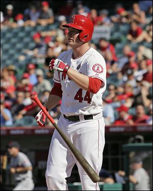 Los Angeles Angels' Mark Trumbo tosses his bat after striking out during the first inning of a baseball game against the Cleveland Indians on Wednesday, Aug. 21, 2013, in Anaheim, Calif. (AP Photo/Jae C Hong)