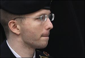 Army Pfc. Bradley Manning is escorted into a courthouse in Fort Meade, Md., today before a sentencing hearing in his court martial. 