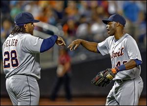 The Tigers' Torii Hunter, right, and Prince Fielder celebrate after their win against the Mets in New York. The Tigers won 6-1.