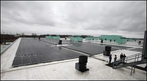 The nearly completed solar panel array on the roof of the GM Toledo Transmission plant on Alexis Road is just one of  the automaker’s energy-saving efforts.