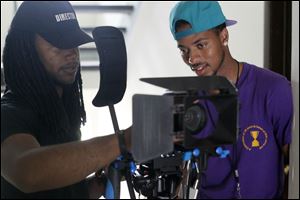 Melvin Claybrooks, left, consults with actor Nehemiah ‘Nemo’ McCreary during filming of  ‘Innerview.’ 