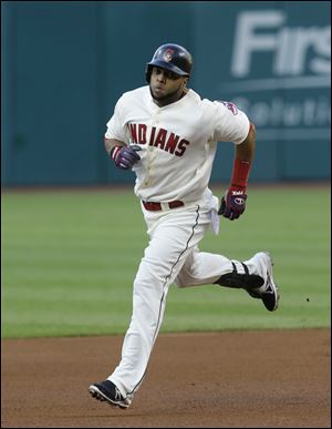 Cleveland's Carlos Santana runs the bases after hitting a two-run home run off Minnesota Twins starting pitcher Liam Hendriks in the first inning Saturday, in Cleveland.
