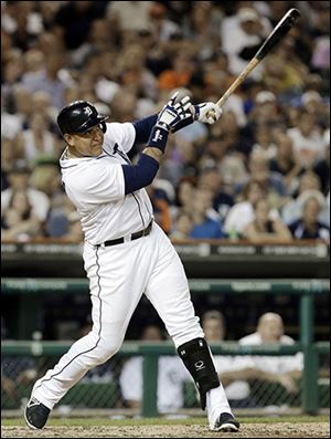 Detroit Tigers' Miguel Cabrera hits a two-run home run against the Oakland Athletics in the fifth inning of a baseball game in Detroit, Monday, Aug. 26, 2013. (AP Photo/Paul Sancya)