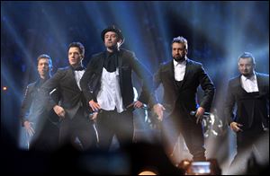 From left, Lance Bass, JC Chasez, Justin Timberlake, Joey Fatone, and Chris Kirkpatrick of 'N Sync perform at the MTV Video Music Awards at Barclays Center on Sunday night in Brooklyn, N.Y.