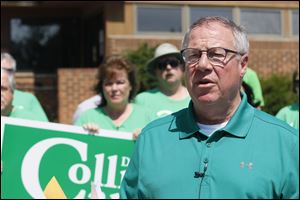 D. Michael Collins, in front of the closed northwest Toledo district police station in West Toledo, said if elected he would reopen the facility. 